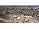An aerial view of new homes under construction in a Primary-planned community, showcasing a neighborhood near a sprawling city at 1204 Powerwall Pl, Henderson, NV 89012