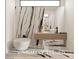 Contemporary bathroom with a standalone tub, marble accent wall, floating vanity, and striking fixtures at 1204 Powerwall Pl, Henderson, NV 89012
