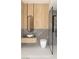 Bright bathroom featuring sleek black fixtures, modern vessel sink, frameless glass shower, and gray marble-look walls at 1204 Powerwall Pl, Henderson, NV 89012