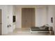 Bright main bedroom suite featuring a modern bed, an accent wall, and built-in storage at 1204 Powerwall Pl, Henderson, NV 89012