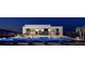 Stunning modern home featuring a sleek pool with an incredible outdoor living space and city views at 1204 Powerwall Pl, Henderson, NV 89012