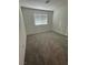 Bedroom features neutral carpet and a window letting in natural light at 12170 Midnight Pine Rd # 3, Las Vegas, NV 89183
