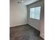 Bright bedroom with gray vinyl flooring and a window at 12170 Midnight Pine Rd # 3, Las Vegas, NV 89183