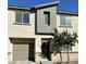Charming two-story home with a modern architectural design and well-maintained front yard at 12170 Midnight Pine Rd # 3, Las Vegas, NV 89183