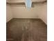 Walk-in closet with carpet floors and built in shelving at 12170 Midnight Pine Rd # 3, Las Vegas, NV 89183