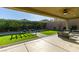 Beautiful backyard with artificial turf, patio area, pergola, and lush landscaping at 124 Strone St, Henderson, NV 89012