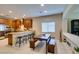 Modern kitchen with stainless steel appliances, granite countertops, and breakfast bar seating at 124 Strone St, Henderson, NV 89012
