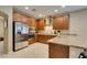 Stylish kitchen with stainless steel appliances, granite countertops, and ample cabinet space at 124 Strone St, Henderson, NV 89012