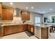 Spacious kitchen featuring granite countertops, stainless steel appliances, and a convenient kitchen island at 124 Strone St, Henderson, NV 89012
