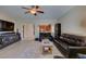 Inviting living room with comfortable seating, an entertainment center, and seamless flow to the kitchen at 124 Strone St, Henderson, NV 89012