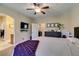 Main bedroom with carpet, ceiling fan, and ensuite bathroom with vanity mirror at 124 Strone St, Henderson, NV 89012
