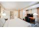 Bright bedroom featuring a plush king-size bed, work desk, and access to an en suite bathroom for added convenience at 135 E Harmon Ave # 2420, Las Vegas, NV 89109