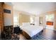 Comfortable bedroom featuring a king bed and a relaxing sitting area, with an en suite bathroom at 135 E Harmon Ave # 2420, Las Vegas, NV 89109