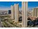 Striking daytime exterior view of a high-rise residential building in an urban setting against a beautiful blue sky at 135 E Harmon Ave # 2420, Las Vegas, NV 89109