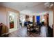 Open-concept living room showcasing stylish furnishings, wood floors, and an ensuite bathroom for added convenience at 135 E Harmon Ave # 2420, Las Vegas, NV 89109