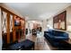 Spacious living room with wood-style flooring, contemporary furnishings, and seamless flow into the kitchen area at 135 E Harmon Ave # 2420, Las Vegas, NV 89109