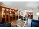 Cozy living room featuring a built-in entertainment center and an adjacent dining area with seating for four at 135 E Harmon Ave # 2420, Las Vegas, NV 89109