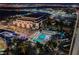 Aerial nighttime view showcasing a luxurious pool area and entertainment venue, perfect for upscale living at 135 E Harmon Ave # 2420, Las Vegas, NV 89109