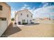 Expansive backyard featuring a patio with seating area, perfect for outdoor relaxation and entertaining at 1512 Bellglen Dr, Las Vegas, NV 89128