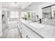 Elegant bathroom featuring double sinks, a soaking tub, and a walk-in shower at 1512 Bellglen Dr, Las Vegas, NV 89128