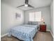 This bedroom boasts natural light and a ceiling fan to create a relaxing atmosphere at 1512 Bellglen Dr, Las Vegas, NV 89128
