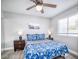 Cozy bedroom with a window, ceiling fan, and light gray walls at 1512 Bellglen Dr, Las Vegas, NV 89128