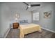 Comfortable bedroom with a ceiling fan and natural light from a large window create a relaxing space at 1512 Bellglen Dr, Las Vegas, NV 89128