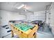 The converted garage features recreational games, offering additional entertainment space at 1512 Bellglen Dr, Las Vegas, NV 89128