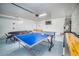 Spacious garage with multiple games, providing versatile recreational opportunities at 1512 Bellglen Dr, Las Vegas, NV 89128