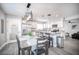 Modern kitchen with stainless steel appliances, a breakfast bar, and gray countertops at 1512 Bellglen Dr, Las Vegas, NV 89128