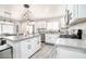 Bright kitchen featuring granite counters, stainless appliances, and white cabinetry at 1512 Bellglen Dr, Las Vegas, NV 89128