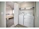 Convenient laundry closet with washer and dryer hookups and easy access to an adjacent bedroom at 1512 Bellglen Dr, Las Vegas, NV 89128