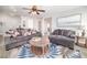 Bright living room featuring an area rug with blue accents and comfortable seating at 1512 Bellglen Dr, Las Vegas, NV 89128