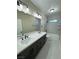 Modern bathroom with double sinks, a large mirror, and a separate shower and tub at 1580 S Tiptop Trl, Pahrump, NV 89048