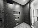 Modern bathroom featuring a luxurious tile shower, rainfall shower head and custom inset shelving at 1580 S Tiptop Trl, Pahrump, NV 89048