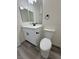 Powder bath features white vanity with black hardware and a standard toilet at 1580 S Tiptop Trl, Pahrump, NV 89048