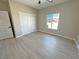 Spacious bedroom featuring light floors and large closet with sliding doors at 1580 S Tiptop Trl, Pahrump, NV 89048