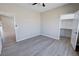 Cozy bedroom with neutral walls, modern ceiling fan, and access to a walk-in closet at 1580 S Tiptop Trl, Pahrump, NV 89048