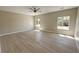Spacious bedroom featuring two windows, neutral colors, and ceiling fan at 1580 S Tiptop Trl, Pahrump, NV 89048