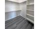 Walk-in closet features built-in shelving and rod for hanging clothes at 1580 S Tiptop Trl, Pahrump, NV 89048