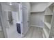 Walk-in closet with built-in shelving and access to the bathroom at 1580 S Tiptop Trl, Pahrump, NV 89048