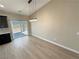 Bright dining area with modern lighting and sliding glass doors at 1580 S Tiptop Trl, Pahrump, NV 89048
