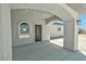 Covered front entrance with an elegant front door and attractive arched windows at 1580 S Tiptop Trl, Pahrump, NV 89048