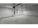 Large garage with ample storage space, featuring a utility closet, an automatic door, and bright lighting at 1580 S Tiptop Trl, Pahrump, NV 89048