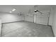 Well-lit, extra large garage, offering epoxy floors and space for two vehicles, ideal for car enthusiasts at 1580 S Tiptop Trl, Pahrump, NV 89048