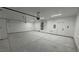 Spacious garage featuring epoxy flooring, overhead lighting, and plenty of room for parking and storage at 1580 S Tiptop Trl, Pahrump, NV 89048