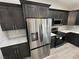 Well-equipped kitchen featuring stainless appliances, wood cabinets, and light countertops at 1580 S Tiptop Trl, Pahrump, NV 89048