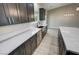 Kitchen countertops featuring stainless dishwasher and sink with light countertops and wood cabinets at 1580 S Tiptop Trl, Pahrump, NV 89048