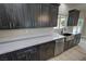 Kitchen featuring stainless appliances, light countertops, wood cabinets, and modern sink at 1580 S Tiptop Trl, Pahrump, NV 89048