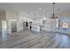 Well-lit kitchen with stainless steel appliances, island, and ample counter space at 1580 S Tiptop Trl, Pahrump, NV 89048